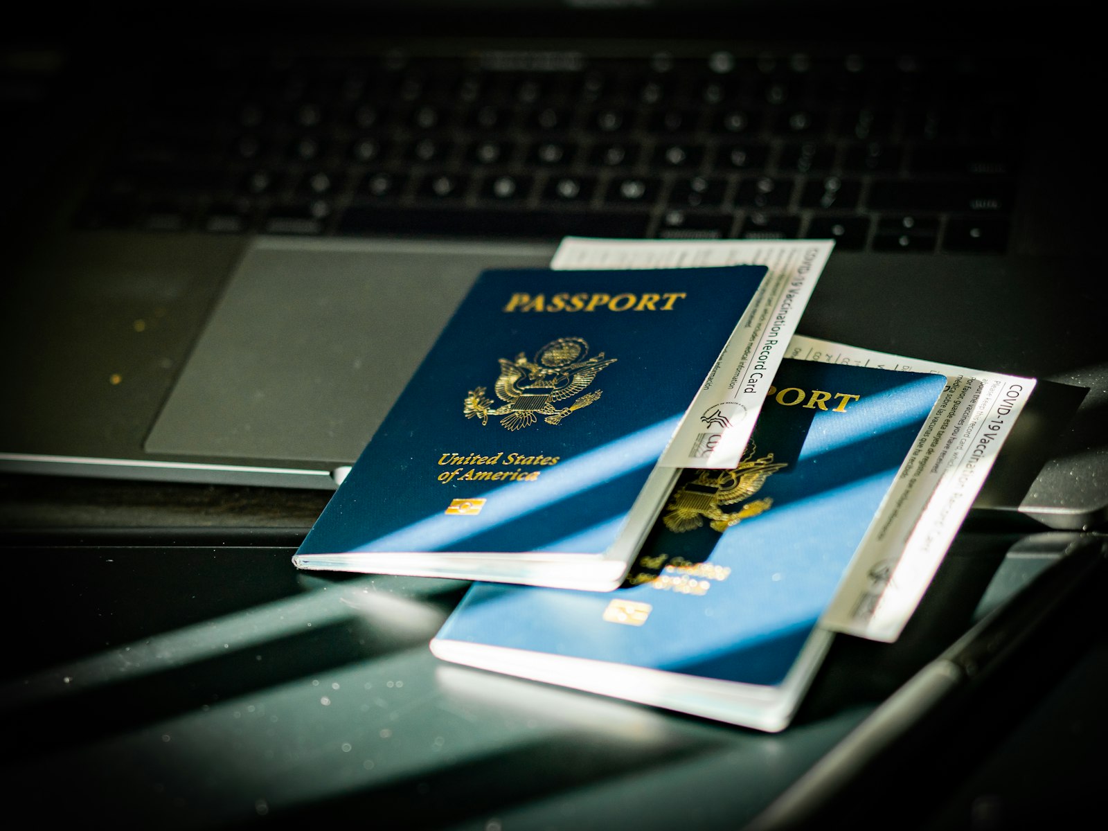 U.S. passport on a keyboard, representing Form N-400 and Form N-600 citizenship applications
