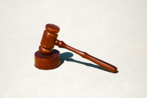Wooden gavel — Good Moral Character review on Form N-400 by USCIS
